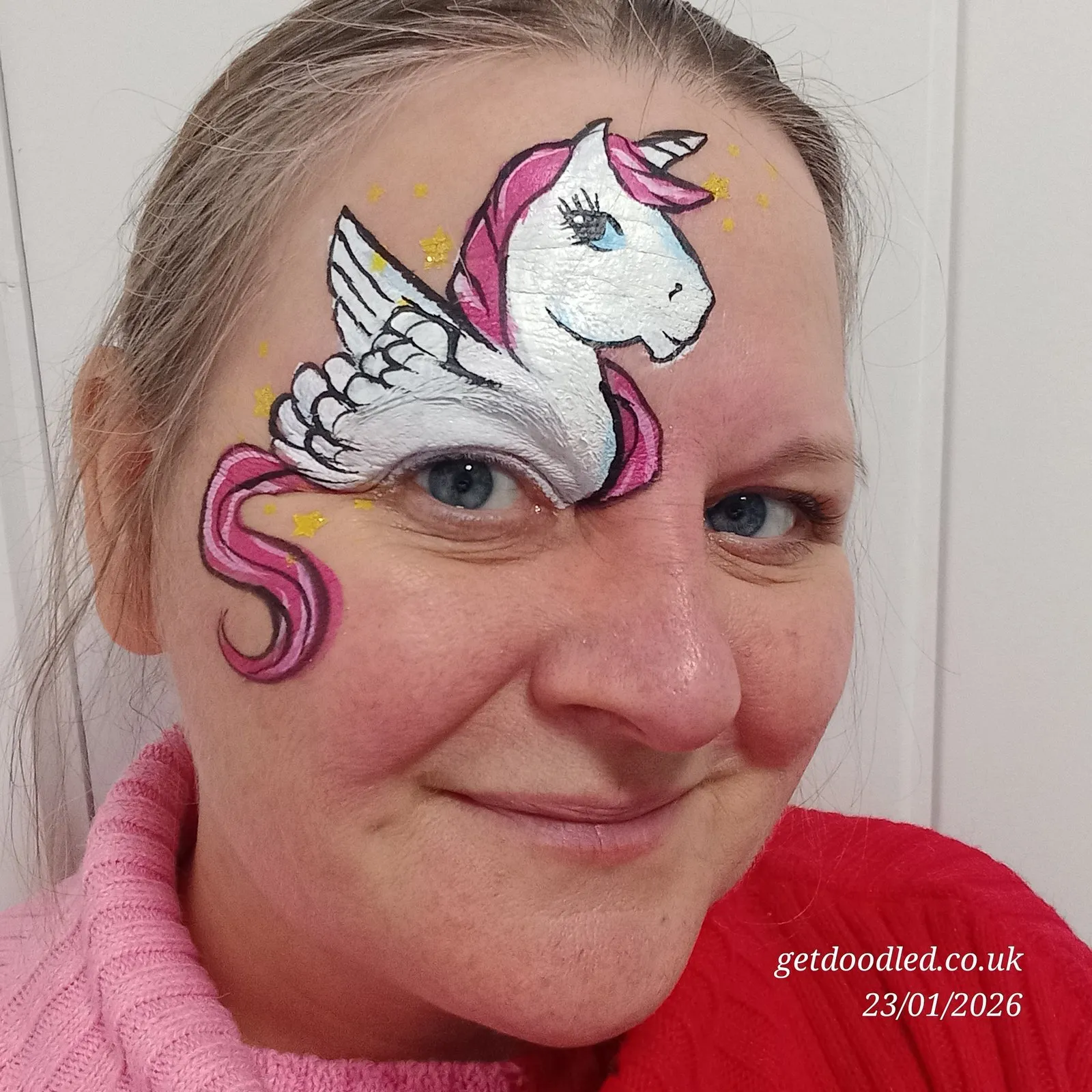A unicorn alicorn face paint with mane and horn