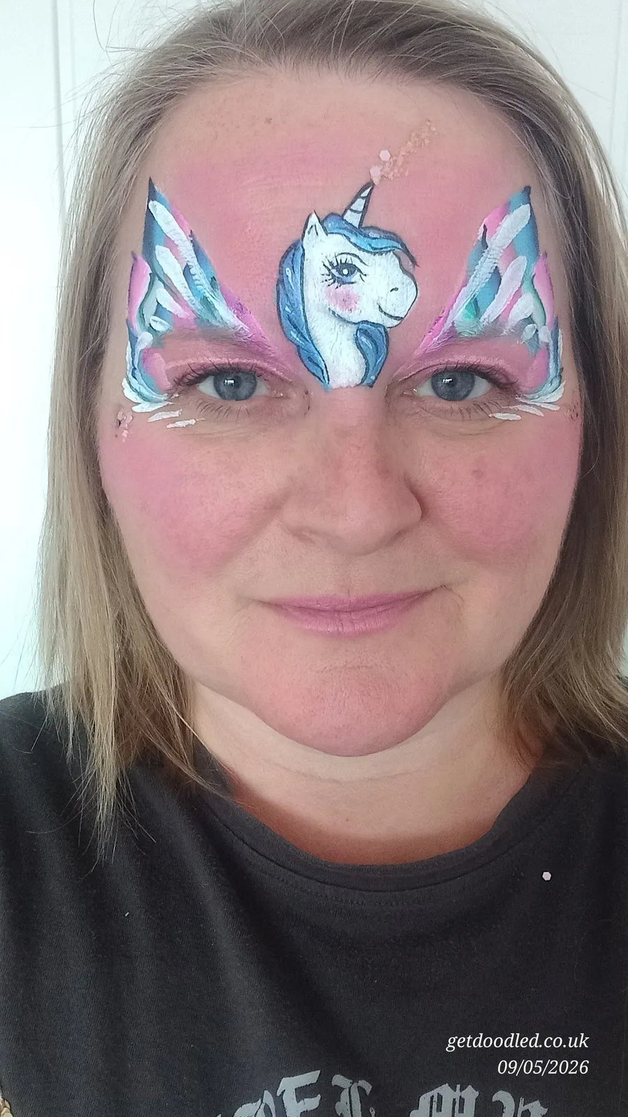 A blue and white unicorn eye design