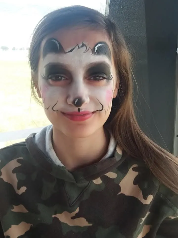 A monochrome clown design on a teenager