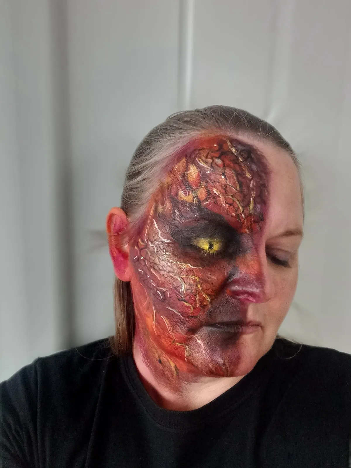 A half-face design of glowing fiery lava