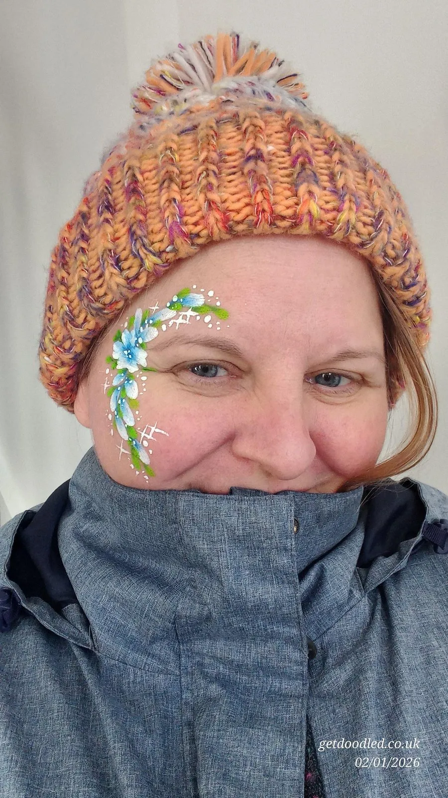 A floral glitter design beside the eye