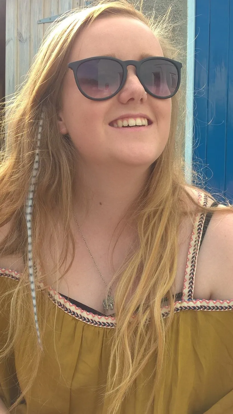 Colourful hair feathers clipped into long hair