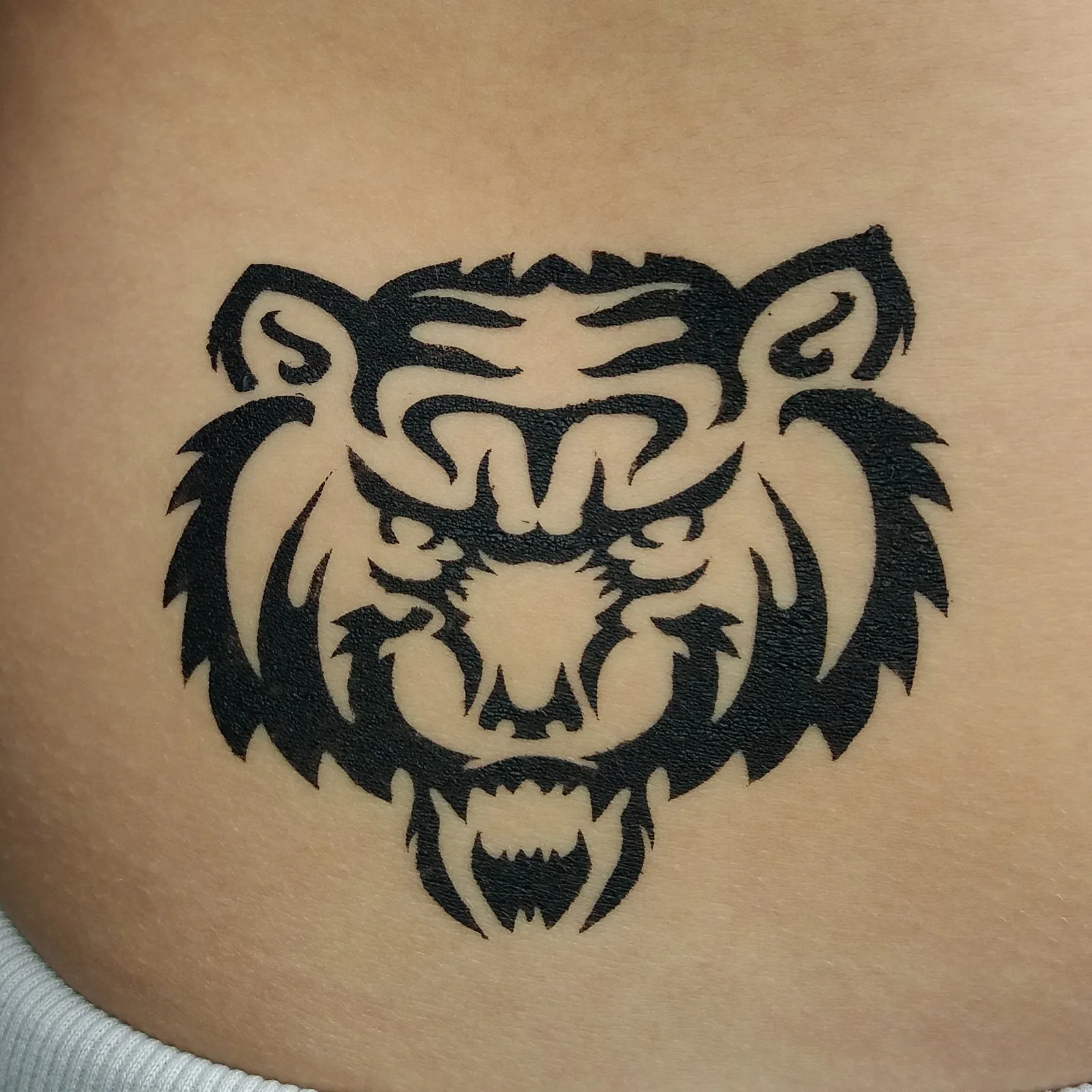 A detailed black ink tiger temporary tattoo