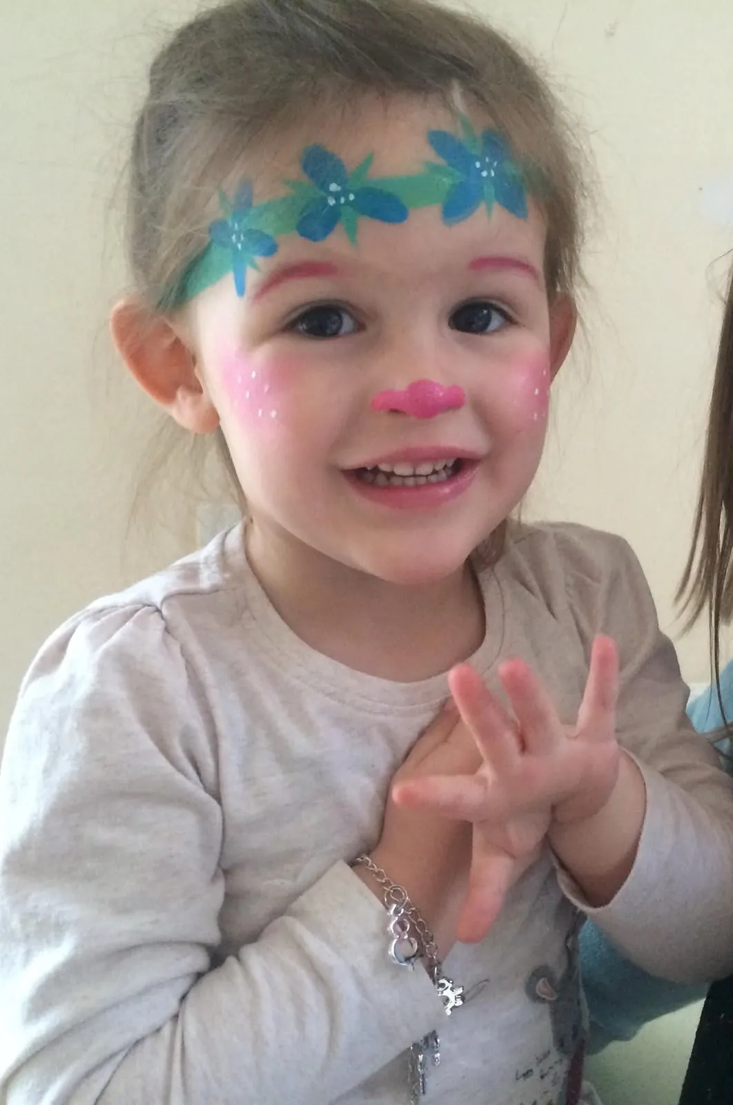 A toddler with a sweet blue floral design