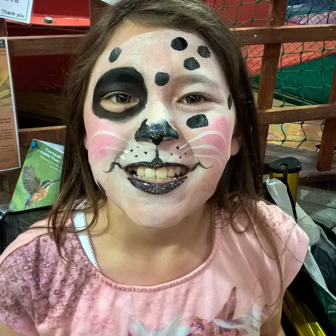 A child painted as a spotty Dalmatian dog